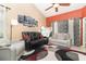 Cozy living room with high ceilings, comfortable seating, and modern decor for a relaxing atmosphere at 109 Lakepointe Cir, Kissimmee, FL 34743