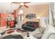 Open concept living area with stylish furnishings, including sofas and a dining table, under a vaulted ceiling at 109 Lakepointe Cir, Kissimmee, FL 34743