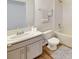 Clean bathroom with tile flooring, vanity, toilet, mirror, and shower with tub combination at 1114 Camden W Way, Poinciana, FL 34758