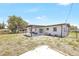 The backyard features an open space, small patio, and some landscaping at 1118 Roberta Ave, Orlando, FL 32825