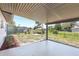 This covered patio provides a shady spot to relax in the backyard at 1118 Roberta Ave, Orlando, FL 32825