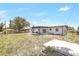 The backyard features an open space, small patio, and some landscaping at 1118 Roberta Ave, Orlando, FL 32825