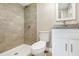 Bathroom featuring a walk-in shower and vanity sink with granite countertops at 1118 Roberta Ave, Orlando, FL 32825