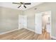 Bedroom with laminate floors, an ensuite bath, and a ceiling fan at 1118 Roberta Ave, Orlando, FL 32825