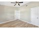 Bedroom with laminate floors, closet and fan at 1118 Roberta Ave, Orlando, FL 32825