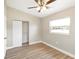 Bright bedroom featuring modern ceiling fan, and closet at 1118 Roberta Ave, Orlando, FL 32825