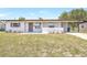 Charming home with a covered porch, fresh landscaping, updated facade, and well-maintained lawn at 1118 Roberta Ave, Orlando, FL 32825