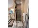 Bathroom with modern fixtures, a walk-in shower, and lots of counter space on the vanity at 1121 Alcove Loop, The Villages, FL 32162