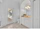 Bright bathroom with a large vanity, walk-in shower, and access to the outdoor patio at 1158 Sweet Heather Ln, Apopka, FL 32712