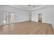 Spacious bedroom featuring double doors, a ceiling fan, and an en-suite bathroom at 1158 Sweet Heather Ln, Apopka, FL 32712