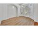 Well-lit room with modern wood floors, bay window, and archway perfect for an office or den at 1158 Sweet Heather Ln, Apopka, FL 32712