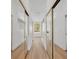Hallway with mirrored closet doors and arched window seat nook at 1158 Sweet Heather Ln, Apopka, FL 32712