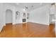 Open living room featuring a fireplace, built-in shelving, and arched doorways at 1158 Sweet Heather Ln, Apopka, FL 32712