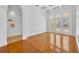 Elegant living room with coffered ceiling, arched doorway, and light-filled windows at 1158 Sweet Heather Ln, Apopka, FL 32712