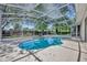 Large screened-in pool with tropical landscaping offers a serene outdoor oasis at 1158 Sweet Heather Ln, Apopka, FL 32712