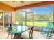 Enclosed patio area with tiled floor and scenic backyard view at 118 Ventana Dr, Poinciana, FL 34759