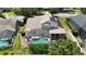 Aerial view of the home featuring a screened-in pool and backyard at 1201 Shelter Rock Rd, Orlando, FL 32835
