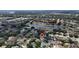 Expansive aerial view of a charming neighborhood featuring a serene lake and lush greenery at 1201 Shelter Rock Rd, Orlando, FL 32835