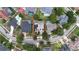 A beautiful aerial view showcases the property's location within a well-maintained neighborhood, surrounded by lush greenery at 1201 Shelter Rock Rd, Orlando, FL 32835