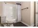 Bathroom featuring a shower with a shower curtain and a toilet at 1201 Shelter Rock Rd, Orlando, FL 32835