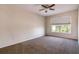 Cozy bedroom with a ceiling fan and a window offering natural light at 1201 Shelter Rock Rd, Orlando, FL 32835