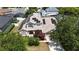 Aerial view of home with solar panels, mature landscaping, and a two car garage at 1201 Shelter Rock Rd, Orlando, FL 32835