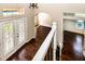 Stairway view of the foyer featuring hardwood floors and an ornate front door at 1201 Shelter Rock Rd, Orlando, FL 32835