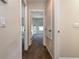 Hallway with an open doorway to a bedroom with two windows at 1201 Shelter Rock Rd, Orlando, FL 32835