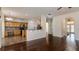 Open-concept kitchen with wood cabinets, stainless appliances, granite countertops, and a breakfast bar seating area at 1201 Shelter Rock Rd, Orlando, FL 32835