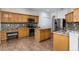Well-equipped kitchen with granite counters, wood cabinets, stainless steel appliances, and a breakfast bar area at 1201 Shelter Rock Rd, Orlando, FL 32835