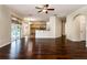 Spacious living room with hardwood floors, ceiling fan, and sliding glass doors leading to the outdoor area at 1201 Shelter Rock Rd, Orlando, FL 32835