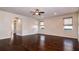 Large living room with natural light, hardwood floors, arched openings and neutral walls, ideal for entertaining guests at 1201 Shelter Rock Rd, Orlando, FL 32835