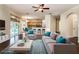 Spacious living room with hardwood floors, modern furnishings, and access to an outdoor pool area at 1201 Shelter Rock Rd, Orlando, FL 32835