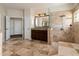 Well-appointed main bathroom with dark cabinetry, walk-in shower, and tiled floors at 1201 Shelter Rock Rd, Orlando, FL 32835
