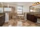 Luxurious main bathroom featuring dual vanities, a soaking tub, and a walk-in shower at 1201 Shelter Rock Rd, Orlando, FL 32835