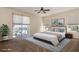 Comfortable main bedroom with a sliding glass door, neutral tones, and a ceiling fan at 1201 Shelter Rock Rd, Orlando, FL 32835