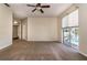 Spacious main bedroom with carpet, ceiling fan, and sliding glass door to the pool area at 1201 Shelter Rock Rd, Orlando, FL 32835