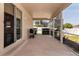 Screened patio with a grill overlooking the backyard and privacy fence at 1201 Shelter Rock Rd, Orlando, FL 32835
