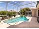 Backyard swimming pool with a screened enclosure and lush landscaping at 1201 Shelter Rock Rd, Orlando, FL 32835