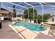 A refreshing pool is enclosed by a screened cage, providing a delightful outdoor space with privacy at 1201 Shelter Rock Rd, Orlando, FL 32835