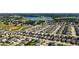 Scenic aerial view of a residential area near a tranquil lake, highlighting the community's natural beauty at 1265 Blarney St, Minneola, FL 34715