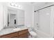 Clean bathroom featuring granite countertop and tiled shower with bathtub at 1265 Blarney St, Minneola, FL 34715