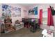 Charming pink themed bedroom with a cozy bed and playful decorations at 1265 Blarney St, Minneola, FL 34715