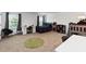 Bright bedroom featuring a large window, a desk, and a comfortable bed at 1265 Blarney St, Minneola, FL 34715