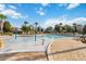 Inviting community pool area with fun water features, and comfortable lounge chairs for a relaxing experience at 1265 Blarney St, Minneola, FL 34715