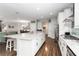 Spacious kitchen with island, stainless appliances, gas range and white cabinetry at 1265 Blarney St, Minneola, FL 34715