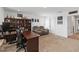 Comfortable living room featuring a large bookshelf and a plush reclining sofa at 1265 Blarney St, Minneola, FL 34715