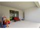 Covered patio featuring a sitting area and access to the backyard, ideal for outdoor relaxation and entertainment at 1265 Blarney St, Minneola, FL 34715