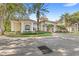 Elegant condo building with manicured landscaping and a welcoming entrance at 1325 Lake Shadow Cir # 12303, Maitland, FL 32751
