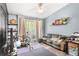Comfortable living room featuring light blue walls and outdoor access at 1325 Lake Shadow Cir # 12303, Maitland, FL 32751